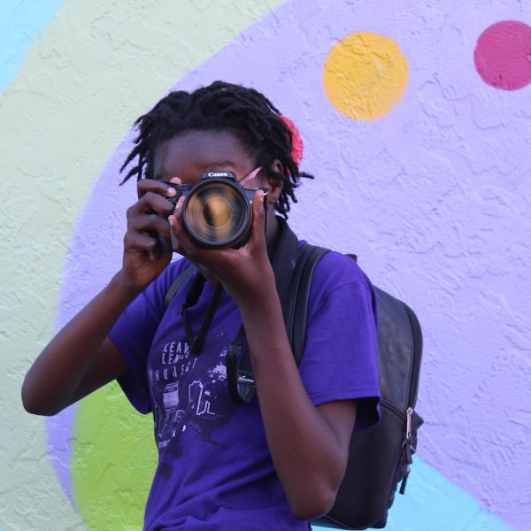 person holding camera to their face