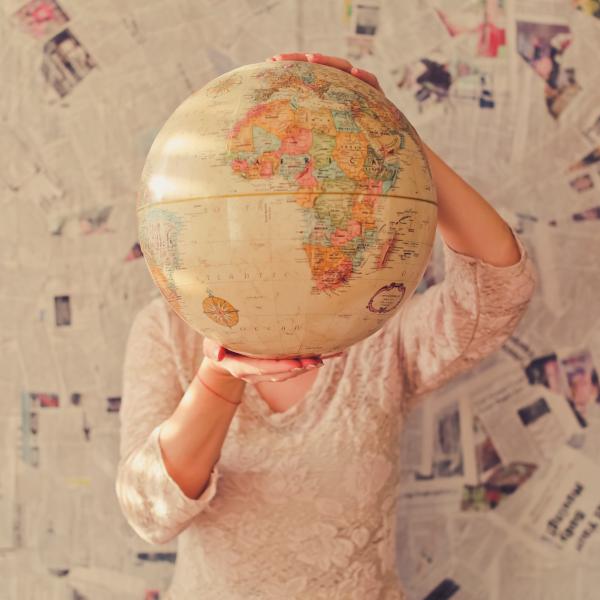 person holding globe