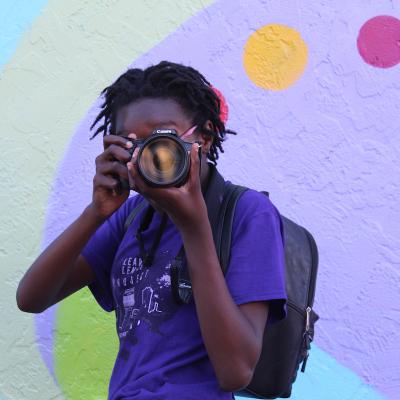 person holding camera to their face