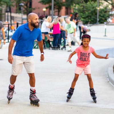 father and daughter roller skating