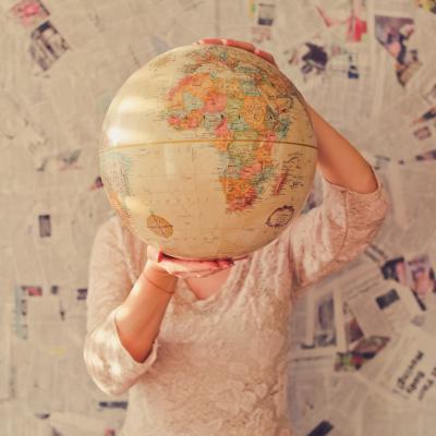 person holding globe